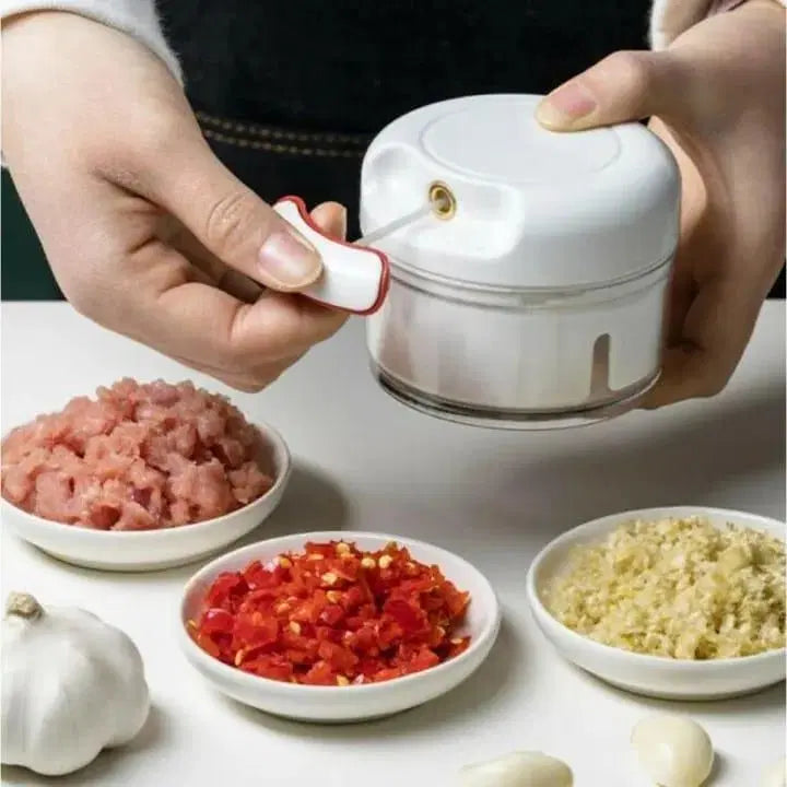 Hand-pull manual food chopper with sharp stainless steel blades for quick vegetable chopping
Compact non-electric food chopper ideal for onions, garlic, fruits, and nuts
BPA-free manual vegetable cutter with pull string mechanism for fast food prep